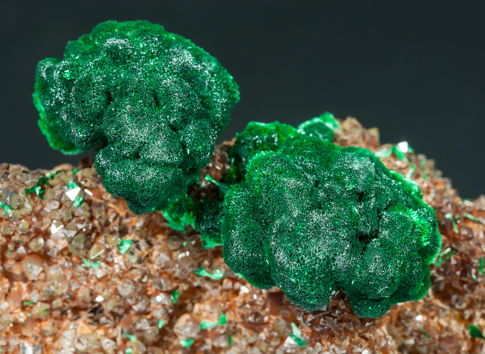 Malachite on Quartz with Goethite inclusions. 