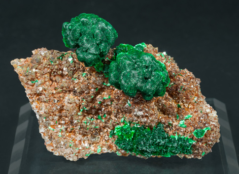 Malachite on Quartz with Goethite inclusions. 