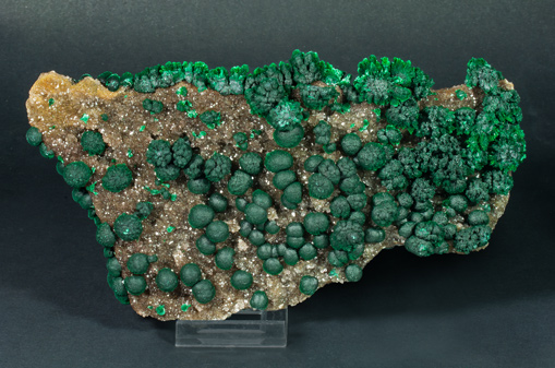 Malachite on Quartz with Goethite inclusions.